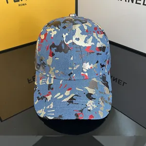 Reflective graffiti camo baseball cap with gold metallic finish and wide brim