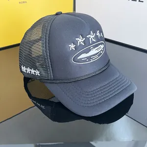 Unisex black mesh trucker hat featuring embroidered white stars and street style logo design