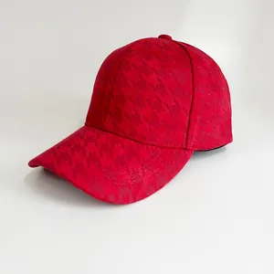 Classic red houndstooth baseball cap with curved brim featuring elegant jacquard texture