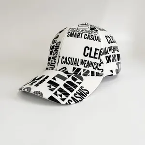 Detail view of the baseball cap with all-over black letter print on white fabric