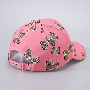 Pink butterfly baseball cap with leopard print details and adjustable metal back buckle