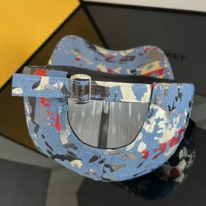 Close-up of colorful graffiti camo baseball cap with adjustable silver metal buckle