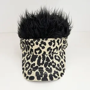 Detailed view of novelty baseball cap with leopard print and black spiky hair wig