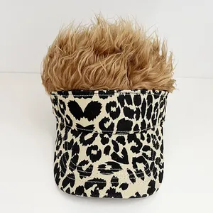 Detailed view of leopard print canvas visor hat with shaggy brown synthetic wig hair