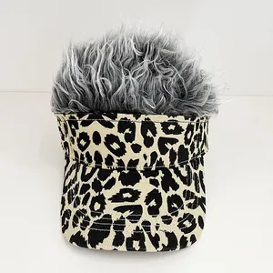 Detailed close-up of visor hat with leopard print canvas and grey synthetic wig hair