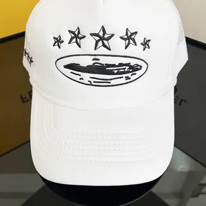 Close-up of black star island embroidery on white breathable mesh trucker hat