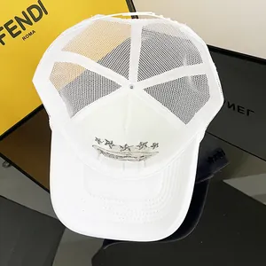 Detail view of breathable white mesh trucker hat featuring interior star patch embroidery