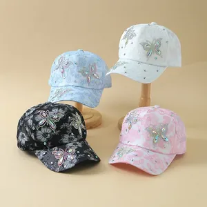 Lace floral baseball caps with rhinestone butterfly detail in four pastel colors