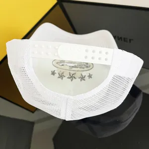 Close-up of the breathable mesh back and adjustable snapback on this white trucker hat