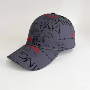 Detailed view of grey baseball cap featuring black and red graffiti letter prints