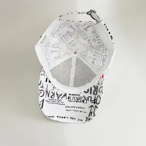 Macro detail of graffiti printed baseball cap with adjustable metal buckle and inner lining