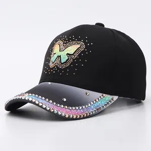 Close-up of sparkling rhinestones and iridescent butterfly sequins on baseball cap