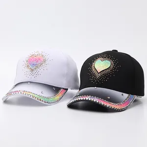 Detail of rhinestone baseball caps with gradient heart sequins in black and white