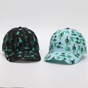Detail view of black and light blue baseball caps with green cactus floral print