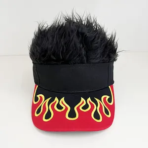 Detailed view of the red brim with flame embroidery and black faux hair on the visor cap