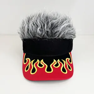 Detail of baseball cap featuring grey wig hair and yellow flame embroidery on red brim