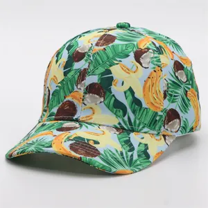 Detail of tropical fruit print baseball cap featuring yellow bananas and green palm leaves