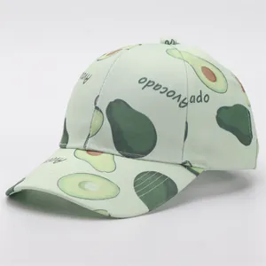 Close-up of light green baseball cap with cute avocado prints and curved brim detail