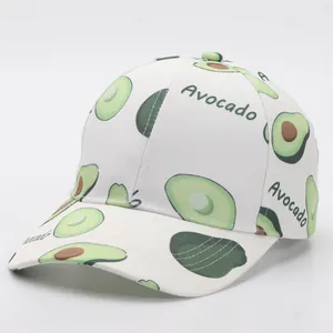 Detail of white cotton baseball cap with green avocado print and Avocado text