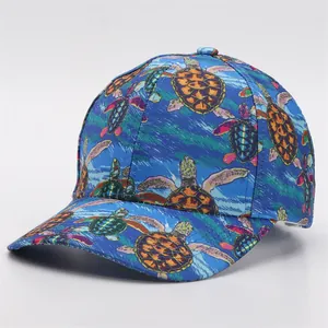 Close-up of vibrant colorful sea turtle prints on a navy blue digital print baseball cap