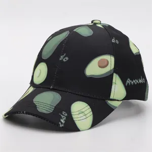 Close-up of fabric texture and avocado print patterns on a black baseball cap