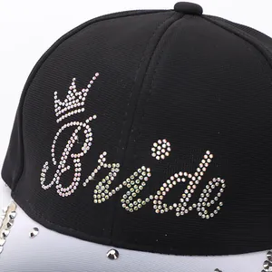 Detail of Bride rhinestone lettering and crown on a black and white baseball cap