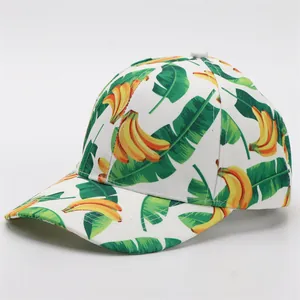 Classic white baseball cap featuring vibrant tropical banana and leaf print patterns