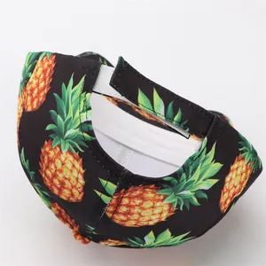 Detail of pineapple print baseball cap showing white adjustable Velcro strap on the back