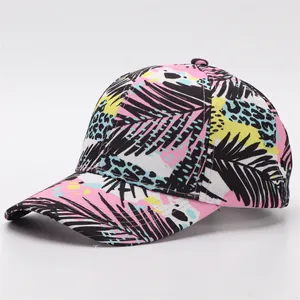 Detail of printed baseball cap with tropical palm leaves and trendy leopard patterns