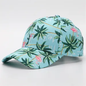 Close-up of baseball cap with tropical flamingo and palm tree print on light blue fabric