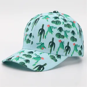 Detail view of the light blue baseball cap featuring vibrant green cactus floral prints