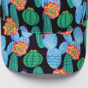 Close-up of baseball cap featuring vibrant cactus and succulent floral print on black fabric