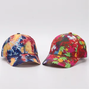 Detail of baseball caps with tie-dye and colorful maple leaf digital prints