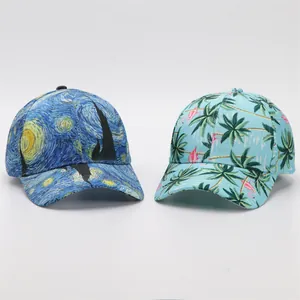 Detail view of digital print baseball caps with Van Gogh Starry Night and flamingo patterns