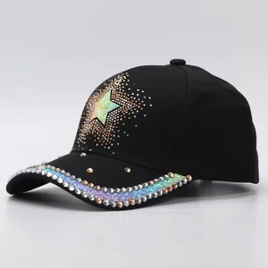 Macro view of crystal rhinestone trim and star pattern on black baseball cap