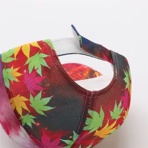 Detail of colorful maple leaf baseball cap showing the adjustable velcro strap closure