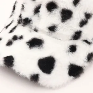 Winter plush baseball cap with fuzzy faux fur and black spots cow print texture