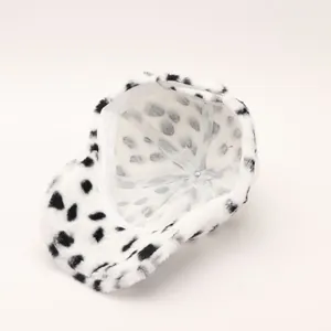 Detail view of plush leopard print baseball cap featuring soft inner lining and warm fabric