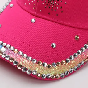 Macro detail of rhinestone edge and glitter on rose red cotton baseball cap