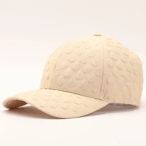 Elegant beige seersucker baseball cap for women with unique textured fabric and curved brim