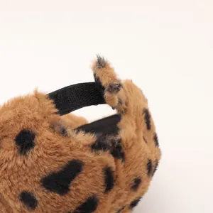 Close-up of fluffy leopard print baseball cap featuring adjustable hook and loop strap