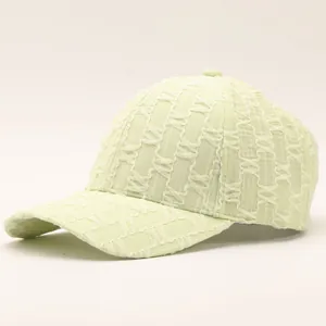 Light green seersucker baseball cap with textured geometric patterns and curved brim