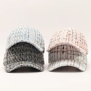 Detailed close-up of tweed baseball caps with metallic threads in multiple pastel colors
