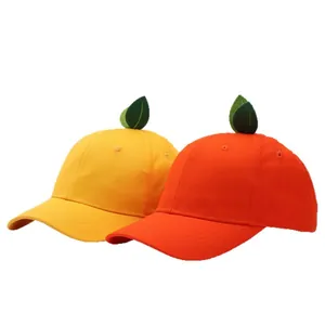 Cute yellow and orange baseball caps with green leaf detail for outdoor family sun protection