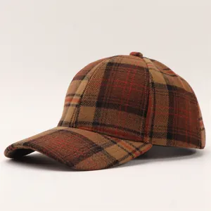 Detail of classic brown plaid wool baseball cap showing thick autumn fabric texture