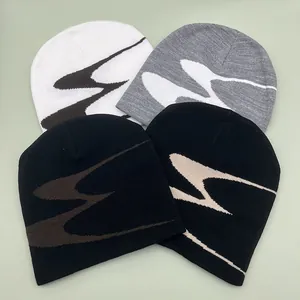 Detailed knit pattern showcase of winter beanies in multiple street style colorways