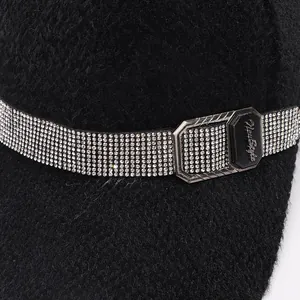 Detail of mink fur baseball cap featuring a rhinestone belt and New Style metal buckle
