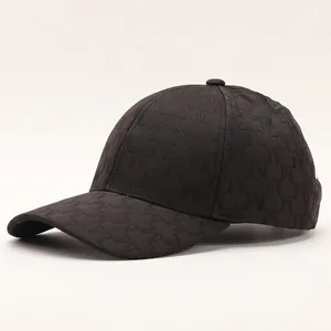 Close-up of winter baseball cap with textured black M-letter embroidery and curved brim