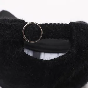 Detailed close-up of winter faux mink baseball cap with silver metal adjustable ring buckle