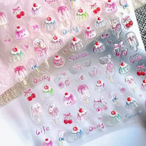 Macro detail of 5D embossed nail art stickers featuring sweet dessert and ice cream patterns